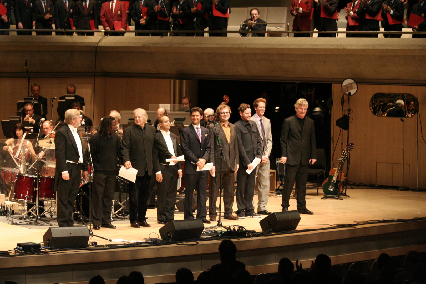 Picture of A Gift of Music cast of St. Michael's Choir School alumni and members of Barenaked Ladies. From left to right, Jerzy Cichocki, Andrew Craig, Michael Burgess, Stewart Goodyear, Matt Dusk, Steven Page, Kevin Hearn, Andy Creegan, John McDermott.